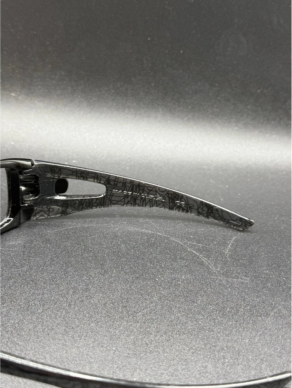 Oakley Crankcase Polished Black/Dark Grey History Text Frame (No Icons)